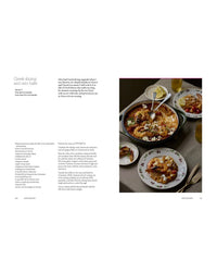 A Meal For Two by Chronicle Books features a Greek shrimp and orzo bake recipe. Ingredients and steps are listed on the left; the right displays the finished dish with lemon wedges, perfect for simple weekday dinners.