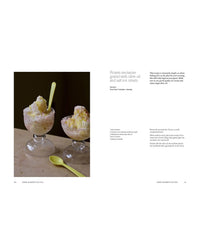 Two glass bowls with grated frozen nectarine, salt ice cream, and olive oil, plus two green spoons—an ideal treat found in "A Meal For Two" by Chronicle Books. Recipe and dessert instructions appear on the right.
