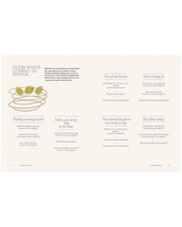 A beige cookbook spread from Chronicle Books' "A Meal For Two" shows six menu ideas with descriptions, such as Cooking for two and The date menu. Three olives in a cocktail glass are illustrated on the left side.