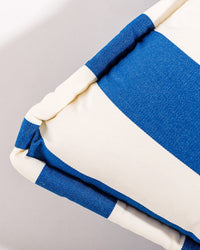 Close-up of the Euro Throw Pillow - Crew Mediterranean Blue Stripe by Business & Pleasure Co: thick Mediterranean blue stripes on light grey, spill-resistant textured fabric for a soft, padded look—ideal for stylish outdoor lounging.