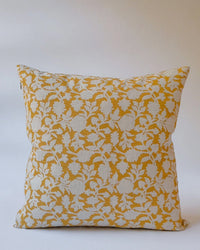 The Tina Linen Pillow - 22 x 22 by Soil to Studio features a yellow and white floral pattern with dense leaves and flowers, bringing artisan charm to any space.