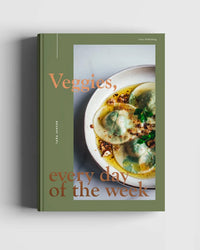 Veggies, Every Day of the Week by Cozy Publishing is a vegetarian cookbook with healthy meal ideas. Its cover shows green ravioli in broth on a minimalist, muted green background, reflecting Scandinavian simplicity and vegetables.
