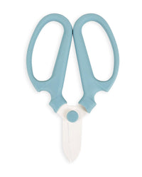 The Floral Society’s Japanese Floral Clippers in Heron, featuring light blue handles and white blades, are shown closed on a white background. The large, rounded handles ensure easy gripping.