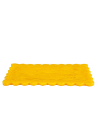 The Casa Amarosa 14in Scallop Resin Rectangular Cheese Board in Mustard is displayed on a white background.