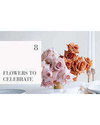 A bouquet of pale pink and peach roses in a vase, styled with expert design, sits on a white table with candles and plates. On the left: "The Flower School" by Chronicle Books—8 flowers to celebrate.