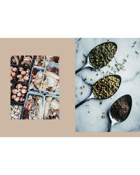 A box of assorted mushrooms beside three metal spoons with green and brown spices on marble—perfect inspiration for healthy meals from Cozy Publishing's "Veggies, Every Day of the Week.