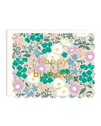 The Happy Birthday Scalloped Floral Single Card by Amy Heitman features colorful green, purple, blue, and white flowers with gold "happy birthday" lettering on a scalloped edge.