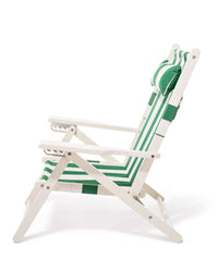 The Business & Pleasure Co Tommy Chair in Acacia White features a green and white Crew Canyon stripe sling with matching headrest, shown reclining from the side against a white background.