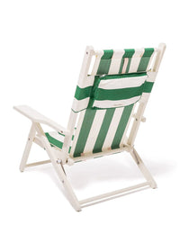 The Business & Pleasure Co Tommy Chair in Acacia White features a green and white Crew Canyon stripe canvas sling with a zippered back pocket, shown on a plain white background.
