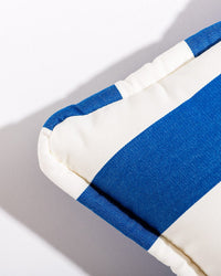 Close-up of the Small Square Throw Pillow - Crew Mediterranean Blue by Business & Pleasure Co, featuring bold blue and white stripes and spill- and stain-resistant fabric, photographed on a white background with a left-cast shadow.