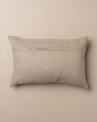 The Saarde Velvet Lumbar Pillow w/ Feather Insert in Nutmeg is shown in a rectangular shape with a plain fabric cover, displayed against a neutral beige background.