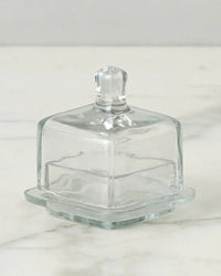 The etúHOME Bistro Glass Jam Jar, Square, is shown with a lid on a white marble surface.