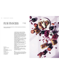 A page from "Queen of the Cakes – Gluten-Free Baking and Artistry" by Cozy Publishing features a plum financiers recipe and an overhead shot with plums and flowers—ideal for gluten-free cake enthusiasts and decorating inspiration.