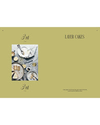 A top view shows plates with cake slices, forks, drinks, and crumbs beside a page reading "Queen of the Cakes – Gluten-Free Baking and Artistry" by Cozy Publishing—ideal inspiration for gluten-free cake recipes.