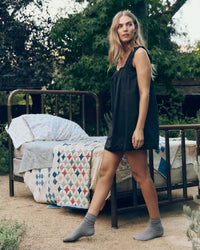 The Eyelet Mini Tank Dress in Black