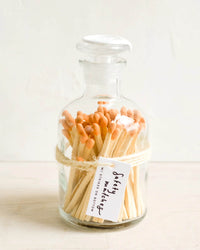LEIF’s Apothecary Jar Matches w/ Wax Seal in Tangelo feature wooden safety matches in a vintage-inspired jar, sealed with a wax stopper and label.