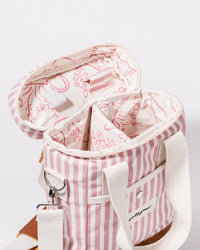 The Wine Cooler Tote Bag - Laurens Pink Stripe by Business & Pleasure Co features pink and white stripes, cream handles, a patterned interior with compartments, and insulation to keep items cool.