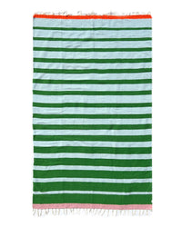 The Marea Vuelta - Blanket Roll by caminito is a handwoven Mexican rectangular picnic blanket featuring green, light blue, orange, and pink stripes with fringe detailing at both ends.