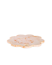 A Casa Amarosa 9in Scallop Resin Cheese/Charcuterie Board in Ivory Pink, handmade with a small hole near the edge, is displayed against a white background.