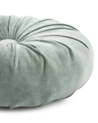 Close-up of the Casa Amarosa Mini Velvet Round Pillow in Sage Green, featuring hand-stitched details, gathered fabric design, and a central button—ideal as a decorative accent.