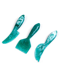 Casa Amarosa’s Resin Cheese Knife Set of 3 in green features unique blade shapes—perfect for stylishly serving cheese. Shown side by side on a white background.