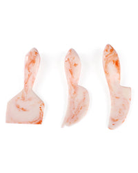 The Casa Amarosa Resin Cheese Knife Set of 3 in Ivory Pink features handmade, marbled knives with unique blade shapes—perfect for charcuterie boards and adding elegance to any entertaining spread.