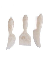 The Casa Amarosa Resin Cheese Knife Set of 3 in Vanilla features white, marbled resin handles and unique blades—an elegant set ideal for your charcuterie board.