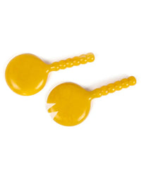 The Casa Amarosa Resin Short Salad Server Set in Yellow includes two plastic servers with rounded, textured handles—one solid spoon and one with fork-like prongs—offering stylish versatility for serving salads.