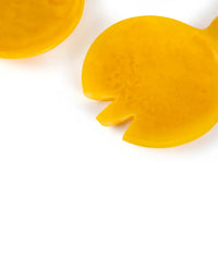 The Casa Amarosa Resin Short Salad Server Set in Yellow features a handmade spoon and notched spork, both shown on a white background to highlight their stylish design.