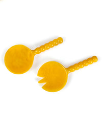 The Resin Short Salad Server Set in Yellow from Casa Amarosa includes two beaded-handle servers—a spoon and a two-prong fork—to add a vibrant touch to any table.