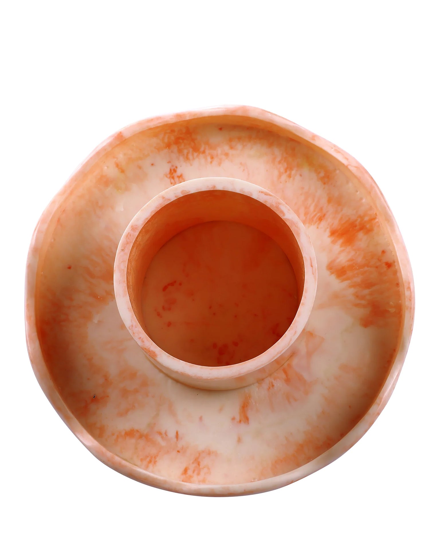 The Scallop Resin Cake Stand in Ivory Pink by Casa Amarosa is a round, shallow handmade stand with an elevated central cylindrical compartment, crafted from marbled orange and white resin and shown from above.