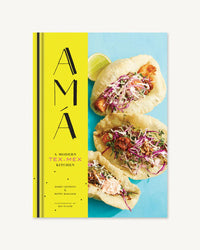 The cover of Ama by Chronicle Books showcases three vibrant tacos against a blue background, celebrating the flavors of modern Tex-Mex cuisine.