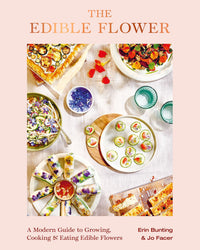 Cover of Edible Flower by Chronicle Books, an organic cookbook showcasing seasonal recipes with vibrant edible flower garnishes, arranged on a light table. Authors and subtitle emphasize its colorful, fresh presentation.
