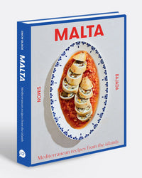 Malta by Chronicle Books is a cookbook that celebrates authentic Maltese cuisine, featuring Mediterranean recipes from the islands and showcasing a plated seafood dish with tomato sauce on its cover.