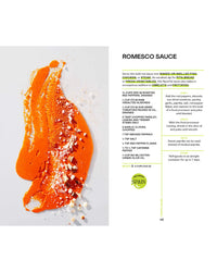 A smear of orange romesco from Saucy by Chronicle Books is artfully spread on white, topped with crumbled bread and slivered almonds—an inspiring sauce idea for everyday cooking. Recipe text appears to the right.