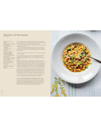 A plate of malloreddus pasta with wild asparagus and cheese sits on a white tablecloth by a fork, alongside a recipe page from Chronicle Books Wild Figs and Fennel Mediterranean cookbook on the left.