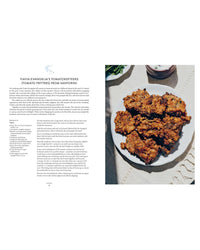 A plate of golden-brown tomato fritters rests on a white cloth, with a Santorini tomato fritters recipe from Yiayia by Chronicle Books printed on the left side of the image.