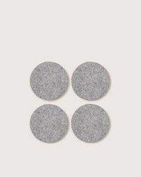 Four round Granite Bierfilzl Merino Wool Felt Coasters by graf lantz, arranged in a square on a light background. Crafted from premium German Merino wool. Pack of 4.