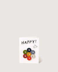 The graf lantz Happy Wine-Otes Merino Wool Felt Wine Marker Note Card features HAPPY! above a small bear and seven colorful Merino wool felt circles, inspired by playful wine charms.