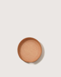 The graf lantz Kobon Leather Round Tray in Natural, shaped round and shallow like a sustainable leather dish, sits centered on a plain white background—an elegant, versatile organizer for any space.
