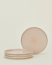 A set of four Hawkins New York Essential Salad Plates in Blush, featuring a subtle circular pattern—stylish stoneware dinnerware ideal for everyday dining.