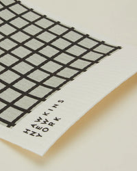 A set of 6 rectangular, eco-friendly Swedish dishcloths in light grey/black from Hawkins New York, each featuring a black grid pattern and branded text on one edge.