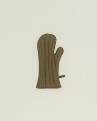 The Hawkins New York Simple Linen Oven Mitt in Olive, with heat-resistant padding, a thumb section, and a small loop for hanging, is shown lying flat on a plain light background.