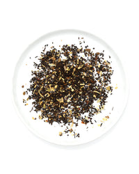 Loose leaf Gochujang Chai Tea by Onyx Coffee Lab, featuring a blend of mixed spices and herbs, displayed on a white plate and photographed from above against a white background. Includes 15 sachets.