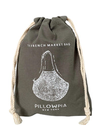 The French Market Bag No.2 in Iron by PILLOWPIA is an organic cotton gray drawstring bag with white rope handles, featuring a pear illustration and the text The French Market Bag and PILLOWPIA New York on the front.