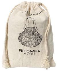 The French Market Bag No.2 in Natural by PILLOWPIA is a cream-colored organic cotton bag with a drawstring closure, featuring garlic artwork and PILLOWPIA NEW YORK printed on the front.