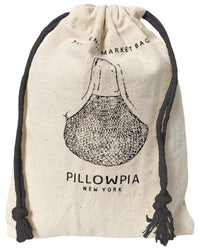 The French Market Bag No.2 in Natural with Monochrome Black by PILLOWPIA is a beige drawstring bag with black cords, featuring a vintage net bag illustration and PILLOWPIA New York text, inspired by classic French market bags.
