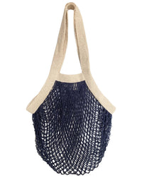 The French Market Bag No.2 In Navy by PILLOWPIA is a reusable organic cotton bag with beige handles and trim, and a navy blue open mesh body inspired by the classic French market bag.
