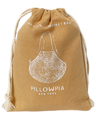 A tan organic cotton bag with white rope, featuring a garlic bulb illustration and the text PILLOWPIA and The French Market Bag No.2 In Wheat.