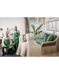 Two people in green aprons pose with Random Houses Rattan furniture in a workshop; nearby, a wicker sofa with green cushions reflects Lulu Lytle’s influence in a stylishly decorated living space.